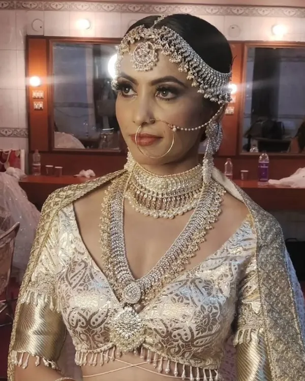 Here is a glimpse of our dedicated makeup station with large mirrors and bright vanity lights, ensuring you have the perfect setup to work on your models before the shoot begins.