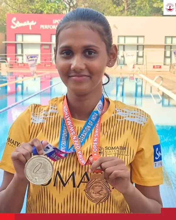 Surbhi Shrikrishna Shinde proudly displays her silver and bronze medals won at the 5th National Finswimming Championship, a great achievement for our junior college athlete.