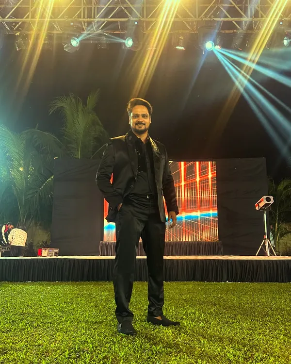 A solo shot from an outdoor event, ready to take the stage. I bring the same level of energy and professionalism whether the event is in a grand ballroom or an open lawn.