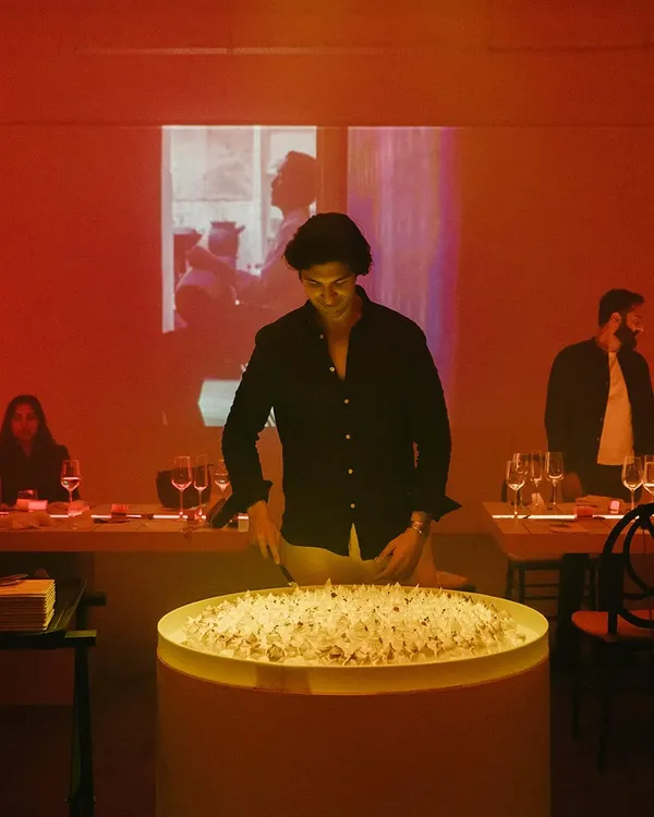 The guest of honor at his 30th birthday party, standing by an oversized cake we created. The brief was to "keep it fun," and we started with a dessert that made a big statement.