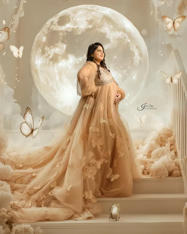 A truly magical maternity portrait, where the mom-to-be stands on a stairway to the moon. This fantasy edit shows how we can create a fairytale scene to celebrate your journey.
