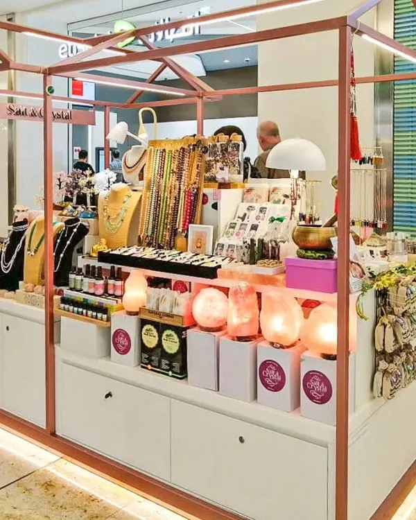 This custom-fabricated jewelry kiosk at Seawood Mall features a sleek metal frame and integrated lighting to make the products sparkle. The design provides ample storage and display space for a professional retail presentation.