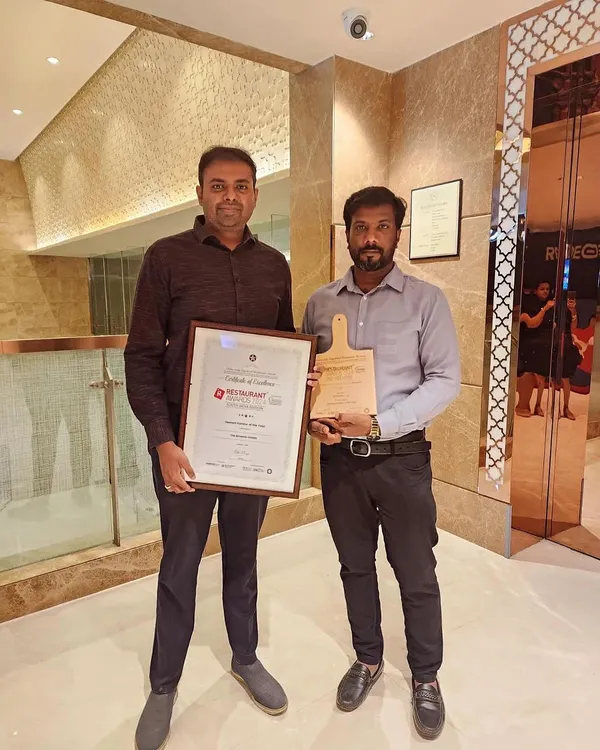 Posing with my head chef and our "Dessert Parlour of the Year" award. This achievement belongs to the entire team that works tirelessly every day.