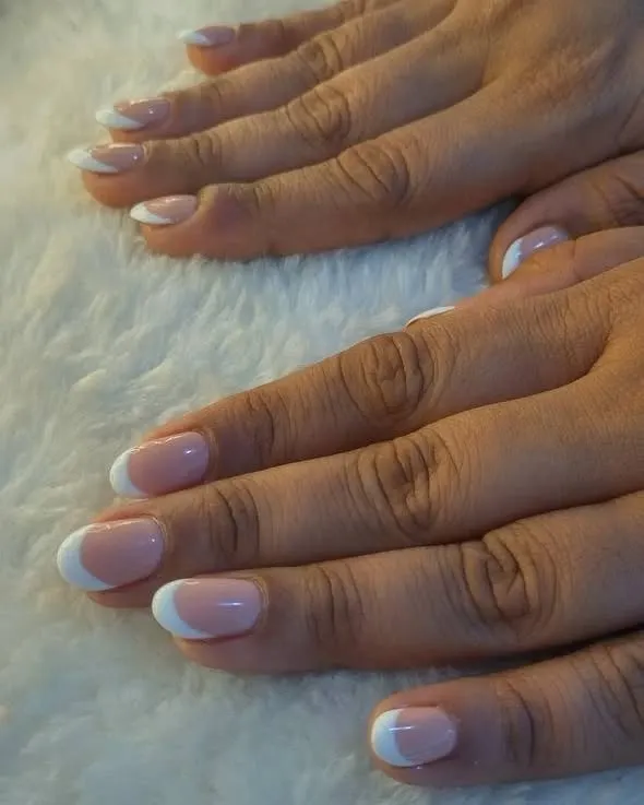The classic French manicure is all about clean lines and finesse. Here is a perfect example on short, rounded nails for an effortlessly chic look.