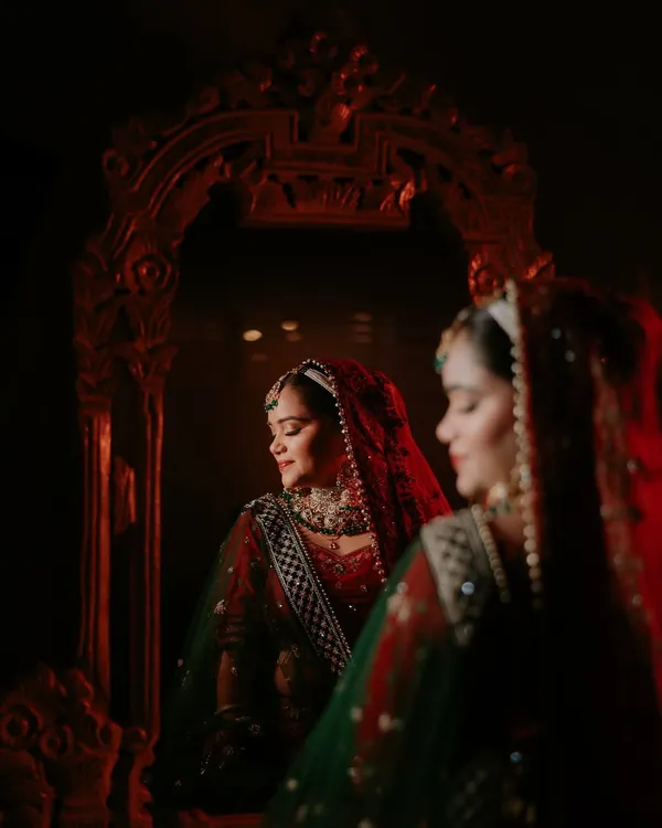 This is one of my favorite styles of bridal portraiture. I use creative lighting and reflections to create a moody, artistic shot that feels timeless and elegant, capturing the bride's quiet moments before the ceremony.