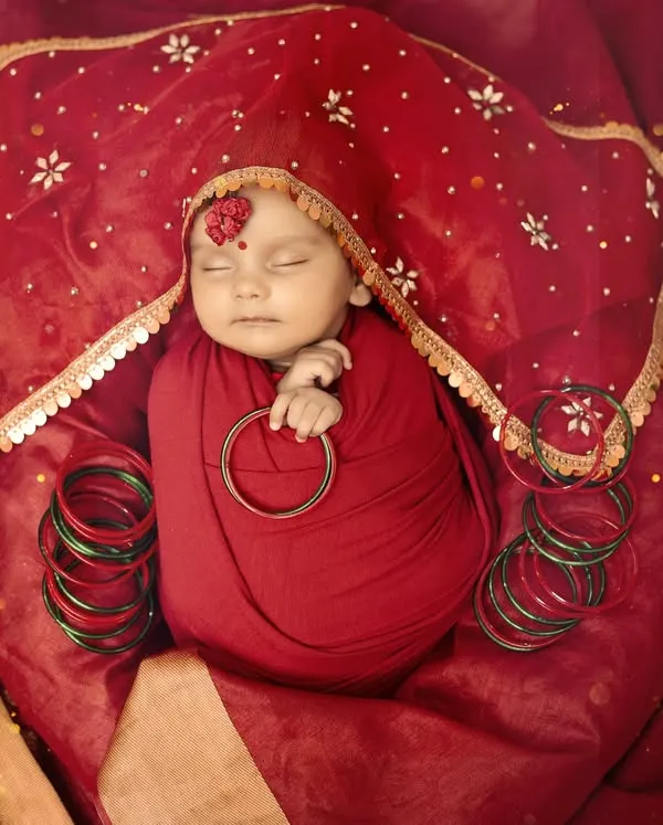 This is the most special way to celebrate your baby's arrival. I styled this newborn session with traditional red fabrics and delicate details to capture the divine spirit of Navratri, creating a timeless portrait for the family to cherish.