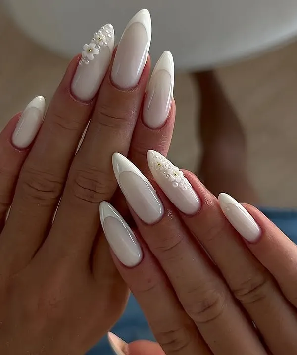 This is the ultimate clean and elegant look. I created these long, almond-shaped gel extensions with a soft milky white base and added delicate, hand-sculpted 3D flowers with pearl centers for a touch of bridal-inspired luxury.