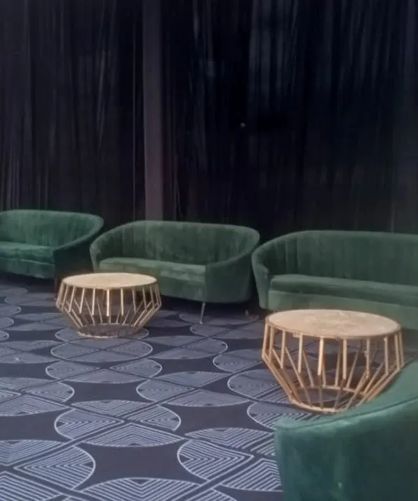 I offer premium furniture rentals, including these luxurious green velvet sofas and geometric gold coffee tables. This type of setup is perfect for creating an exclusive VIP lounge at a corporate event or conference.