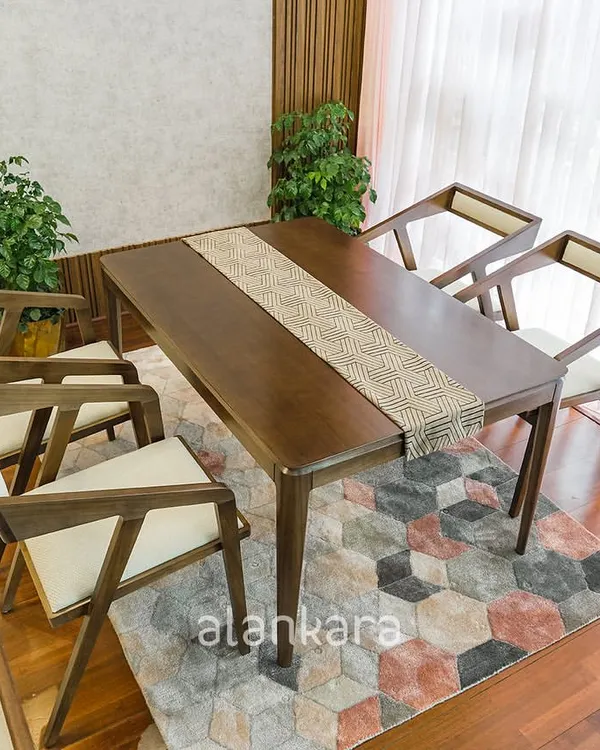Our Zircon dining set features a solid Teak wood table with a sleek, modern profile, paired with our distinctive Z-frame chairs. The chairs are upholstered in a neutral Asian Paints Allura fabric for comfort and style.