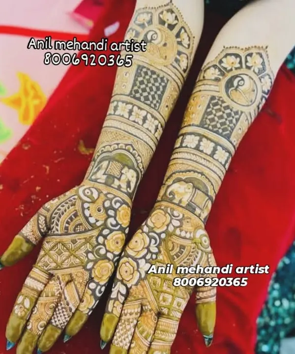A full-coverage bridal design featuring elephant and peacock motifs. The mix of delicate floral patterns and bold geometric shapes creates a stunning contrast.