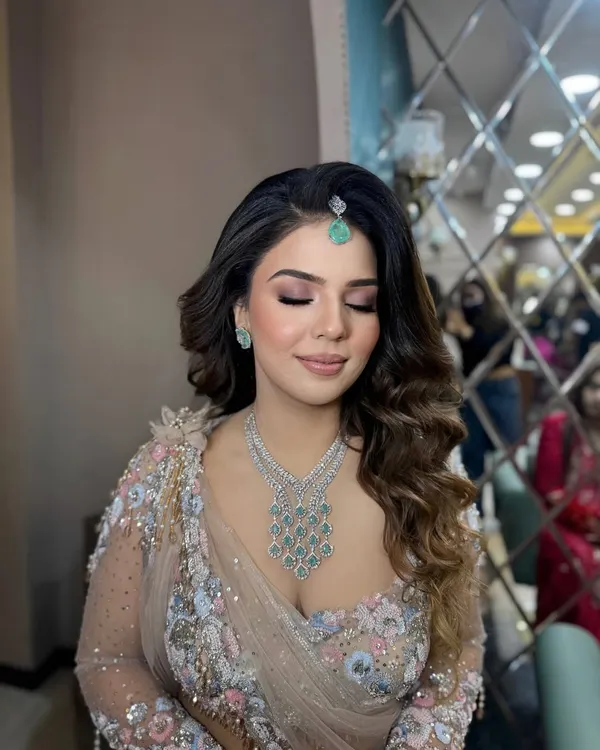 This is my signature soft glam makeup. A flawless base, soft pink smokey eyes, and a neutral lip create a look that's both romantic and sophisticated.