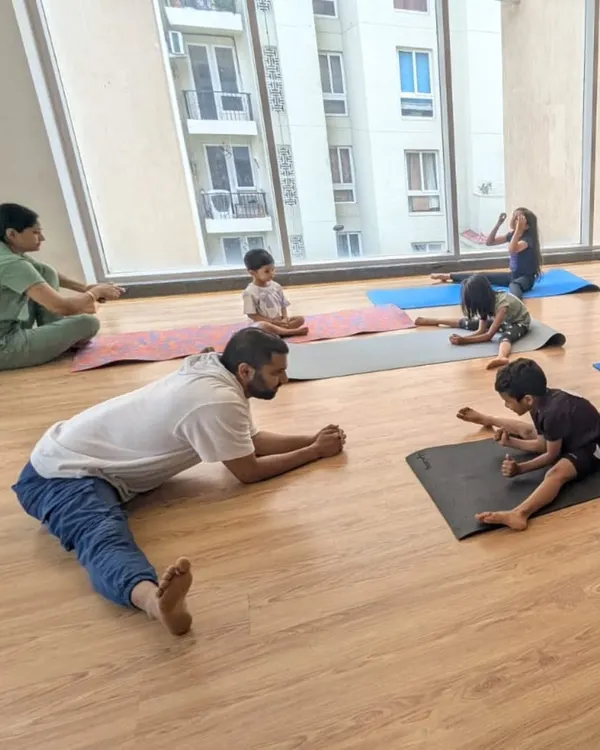 Leading by example during a flexibility session with our young students. Proper stretching is a crucial part of our dance and fitness training.