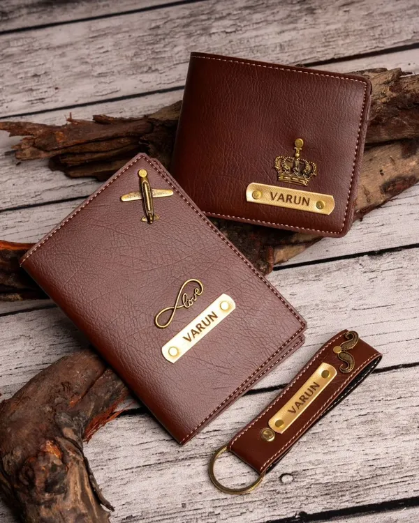 This men's daily essentials kit includes a personalized wallet, passport cover, and keychain. You can mix and match charms, like the airplane and crown shown here.