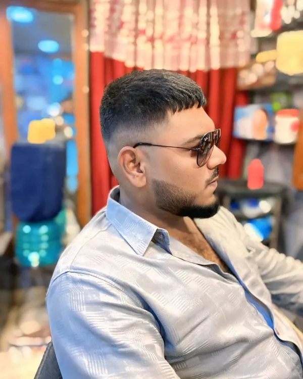 A classic men's crop with a high skin fade. This haircut is clean, sharp, and very low maintenance, perfect for a modern and stylish look.