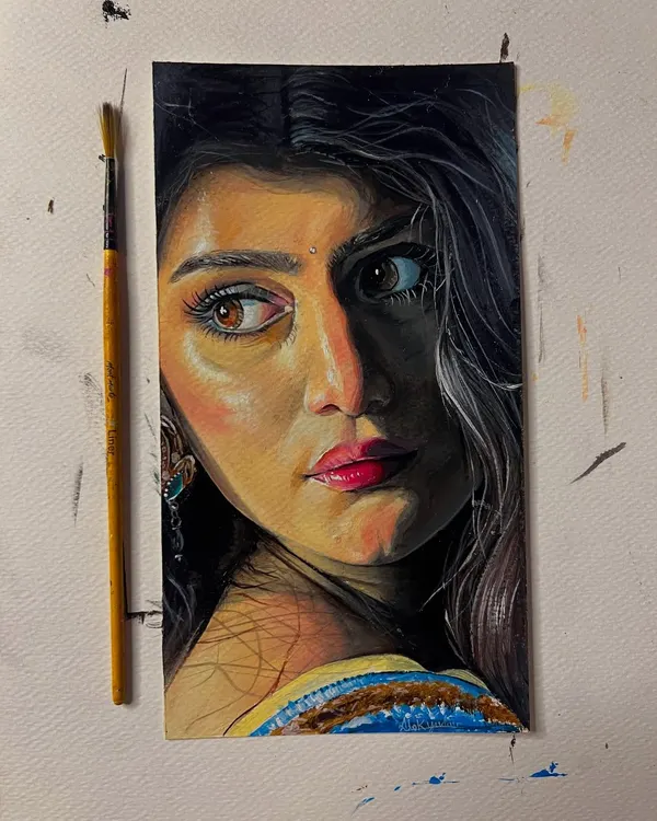 A completed acrylic portrait on short paper. I focused on capturing the story in her eyes and the dramatic lighting on her face.
