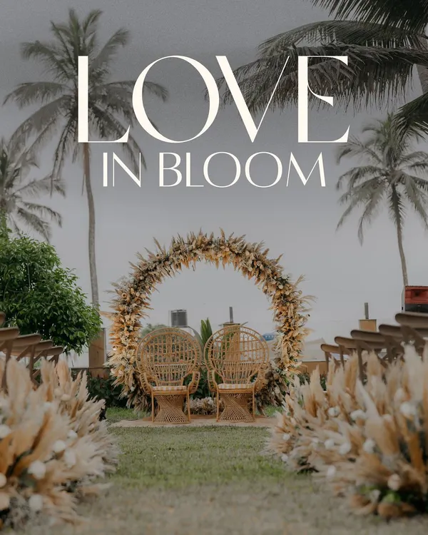 The stunning wedding ceremony setup on a Goan lawn, with a pampas grass arch and the ocean in the background, ready for love to bloom.