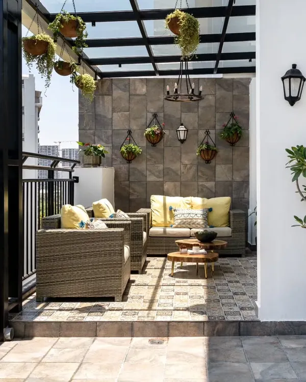 This once-bare penthouse terrace was transformed into a luxurious Spanish-inspired outdoor lounge. Featuring a glass canopy, patterned tile flooring, and comfortable all-weather seating, it is now a magical spot for hosting and relaxation, showcasing our ability to create functional and beautiful exterior living spaces.