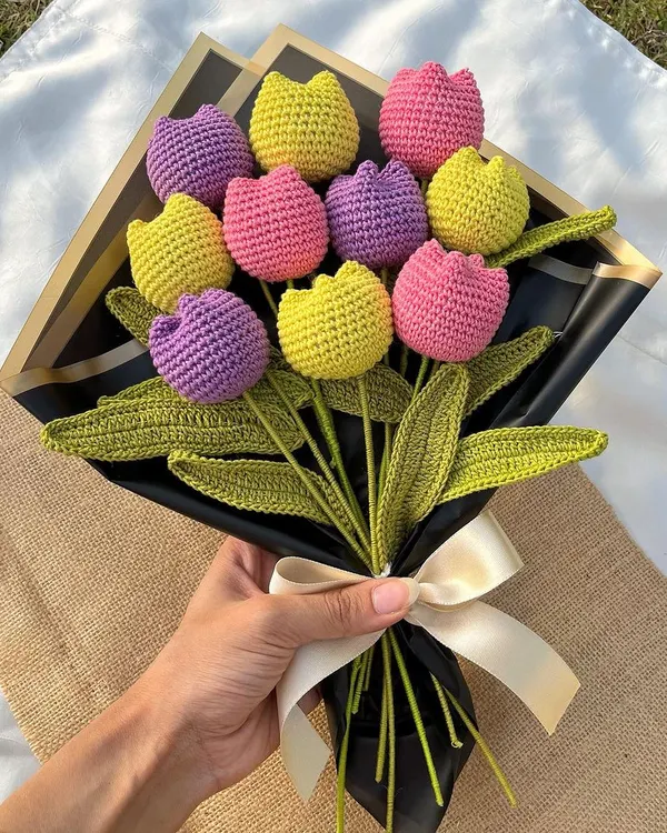 Our 'Twirling Tulips' bouquet is a burst of color and joy. Featuring bright yellow, pink, and purple tulips, it's one of our most popular designs for a reason.