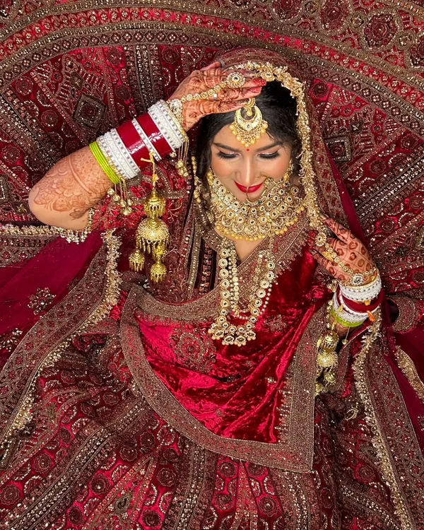This is the essence of a dream bridal look. A stunning, regal bride captured in a moment of quiet elegance, showcasing intricate details, rich colors, and a flawless makeup finish that lasts.