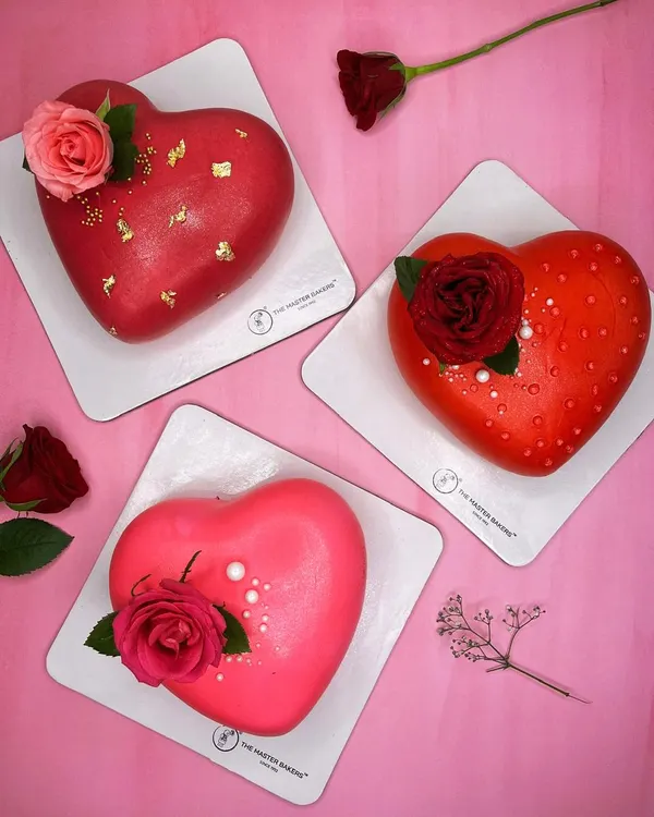 Love comes in many flavors. Here is a trio of our heart-shaped cakes, perfect for Valentine's Day, anniversaries, or just to say "I love you." Each one is uniquely decorated, from gold-flaked red fondant to fresh roses.