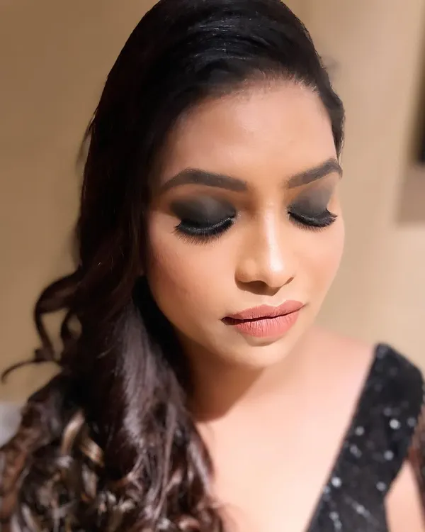 A close-up of the classic black smokey eye, perfect for a cocktail night. The intense black is blended seamlessly and paired with dramatic lashes for a captivating look.