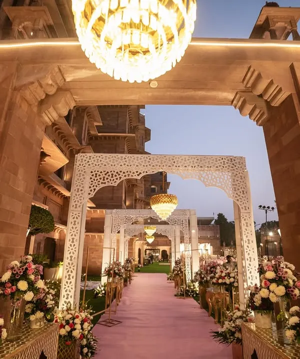 The beautifully decorated entrance to a wedding venue, setting a grand and welcoming tone for the guests. We capture the ambiance you've worked so hard to create.