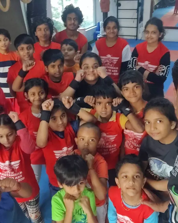 A group photo with my energetic gymnastics batch at the RR Nagar academy. It's great to see them all ready to learn and push their limits together.