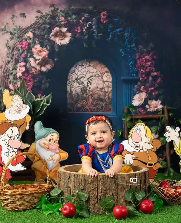 Our little Snow White, surrounded by all seven dwarfs in an enchanted forest. This is one of my favorite fairytale themes to create.