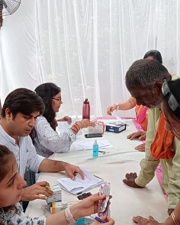 Continuing my father's vision, we organized a free medical camp for the community. Here, our team is busy with vital checks, diet consultations, and medicine distribution for over 350 people.