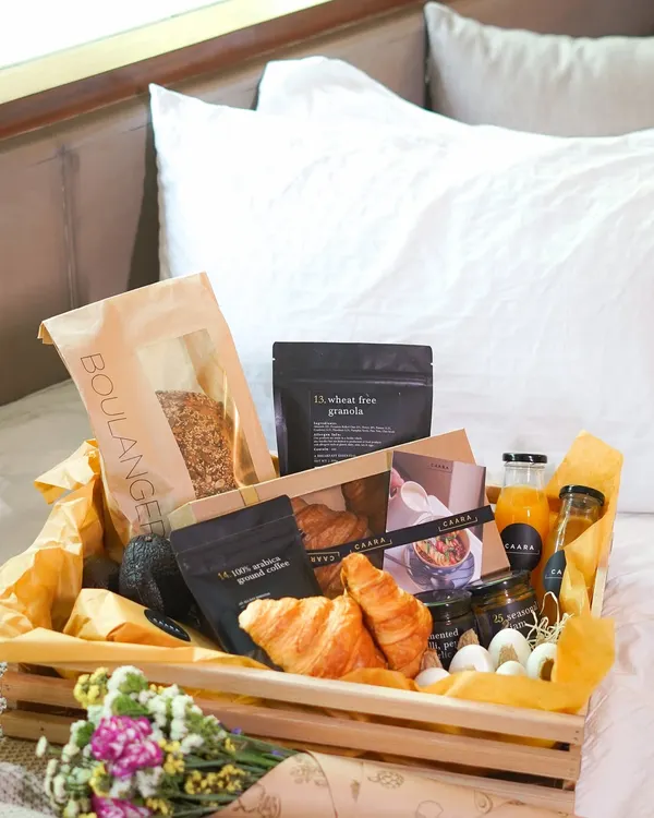 Surprise Mom with our luxurious breakfast-in-bed hamper this Mother's Day. This beautiful wooden crate is filled with fresh croissants, our wheat-free granola, artisanal coffee, fresh juice, and other gourmet treats to start her day perfectly.