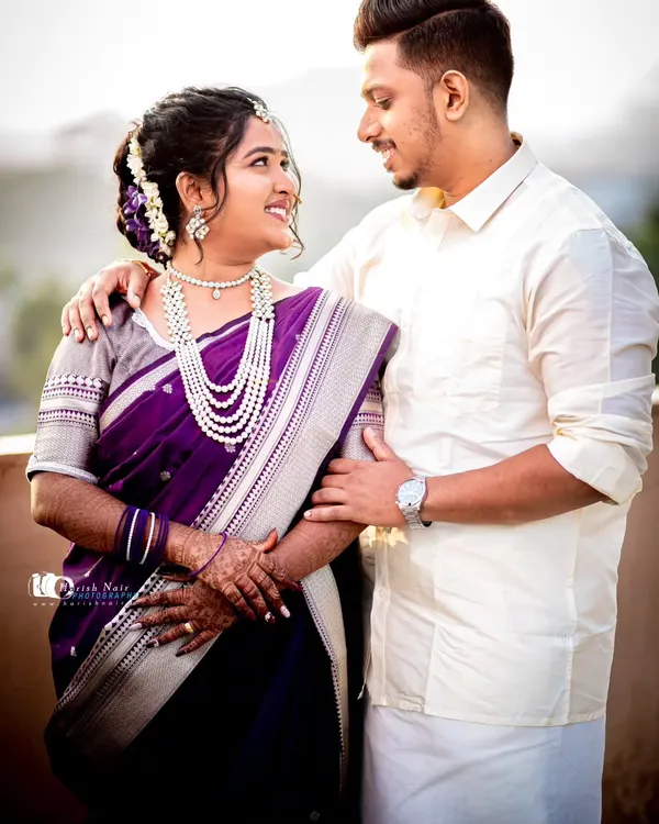 A beautiful wedding day portrait of a South Indian couple. The way they look at each other captures a moment of quiet connection and happiness amidst the day's celebrations.