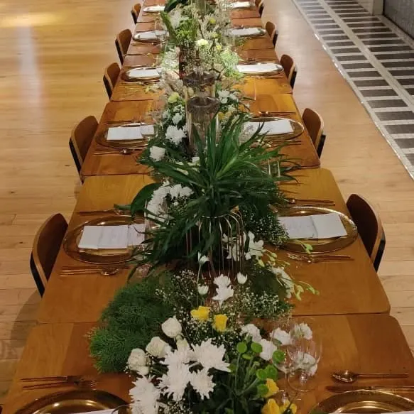 The scene is set for an unforgettable evening. We love creating beautiful tablescapes like this one for a WeWork soirée, complete with floral arrangements and elegant place settings to complement the gourmet meal.
