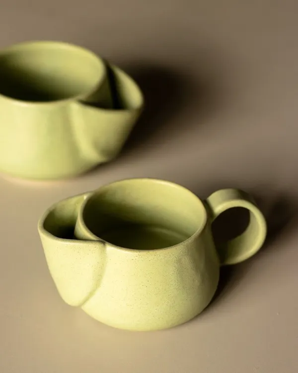 The famous kangaroo mug. We designed this with a clever little pocket on the side to hold your tea bag string or a small cookie. It’s functional, quirky, and a total conversation starter.