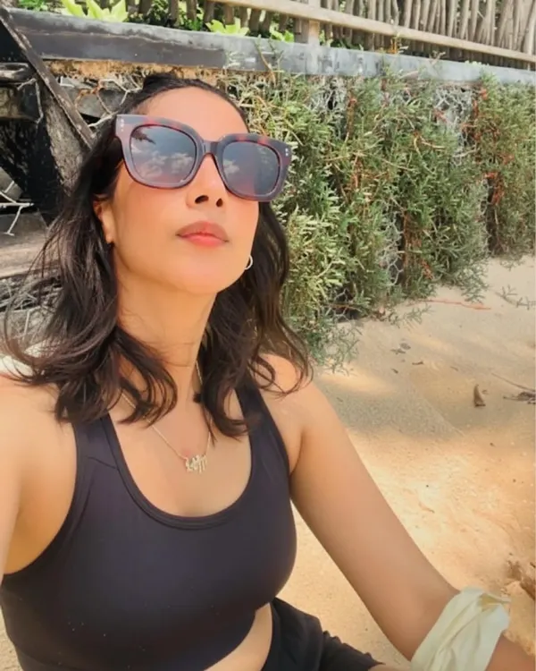 A quiet moment of reflection on the beach. Connecting with nature is an essential part of my wellness routine, helping me stay grounded and centered.