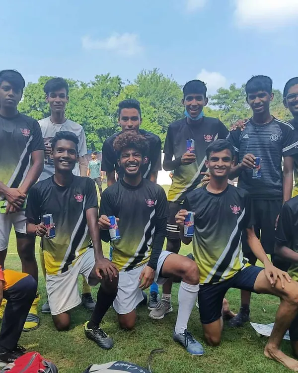 A team relaxes and bonds after a match. The friendships built on the pitch are just as important as the final score.