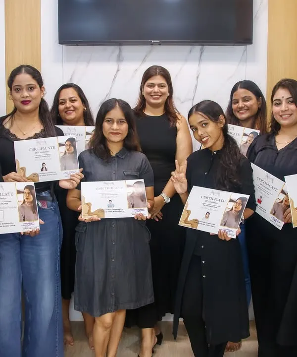 A proud moment with my graduating batch of professional makeup artists. Each student holds a certificate that represents their hard work, dedication, and the start of a new career.