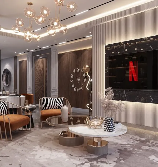 An open-plan living and dining area designed for a builder floor in Sushant Lok, Gurgaon. The space is defined by a bold black marble TV wall, custom accent chairs with zebra print, and a cohesive color palette that feels both elegant and modern.