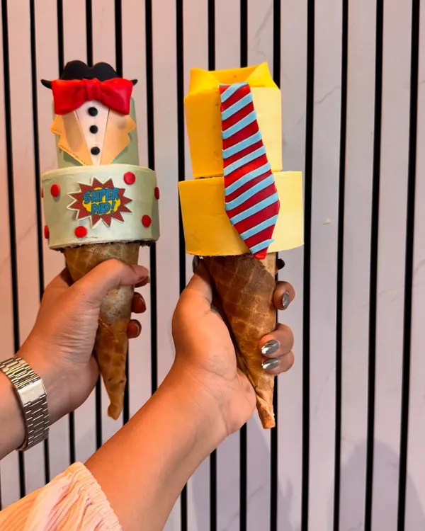 This is my unique 'Conesicle', a special cake in a cone I created for Father's Day. I was so excited to bring this concept to Mumbai for the first time, offering fun, customizable designs like a tuxedo or a shirt and tie for your hero.