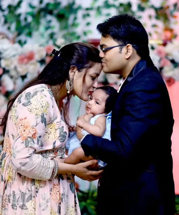 A new family's first portrait together during their baby's naming ceremony. I focus on capturing these priceless, gentle moments as parents embrace their newborn.