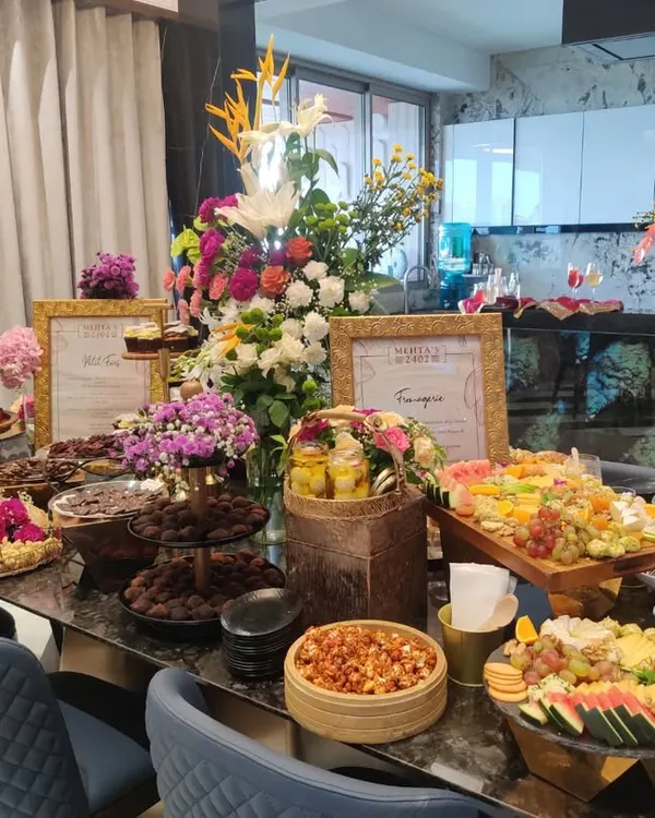 A stunning and abundant grazing table curated for the Mehta family's housewarming soirée. The spread was designed to match the celebratory mood, featuring everything from artisanal chocolates to Indian mithais and savouries.