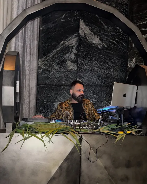 Behind the console is my universe. This custom-designed DJ booth, set against a dramatic backdrop, reflects the premium and bespoke experience I provide for luxury events, where every detail is curated for maximum impact.