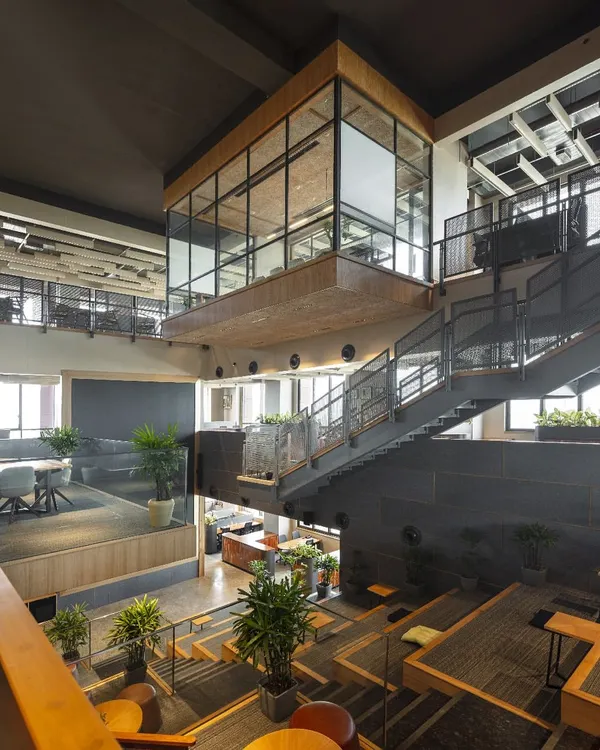 This is the Primarc office in Kolkata, a workspace we designed to be a dynamic ecosystem for collaboration and well-being. The central atrium and terraced seating create a vibrant core, moving beyond traditional cubicles to foster connection and fill the space with natural light.