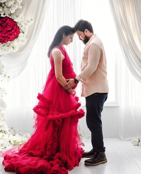 A quiet, shared moment between partners amidst a beautiful floral setup. I guide couples into poses that feel natural and highlight their bond during this special time.