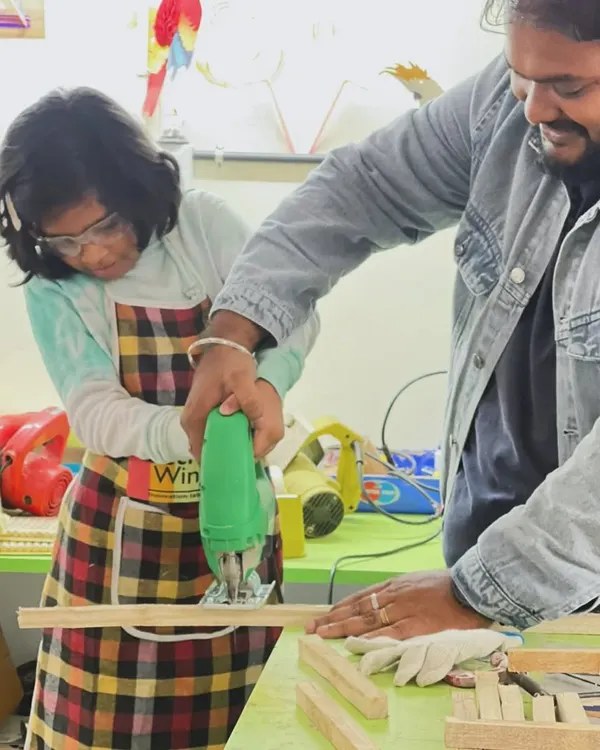 With our complete guidance, this young maker learns to use a jigsaw. We ensure every child understands the tool and feels confident while making precise cuts for their woodworking project.