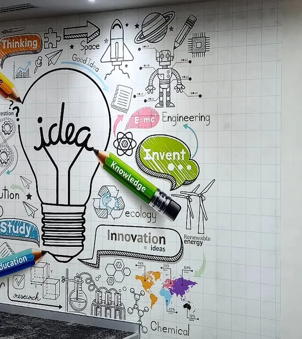 This motivational mural with an 'idea' lightbulb and creative doodles is perfect for a startup or innovation hub. I ensure even complex graphics are installed flawlessly next to office furniture.