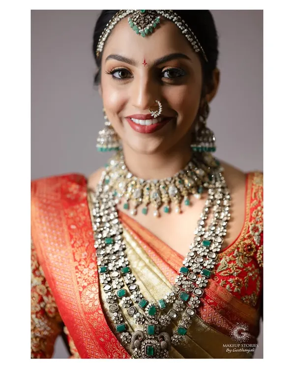 For Likitha's wedding, we chose a classic South Indian bridal look. The focus was on creating luminous, flawless skin that glowed from within, paired with a defined eye and a traditional red lip to complement her stunning Kanjivaram saree and temple jewelry.