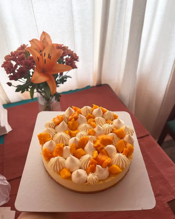 My baked mango cheesecake is a seasonal favorite. It has a creamy, rich cheesecake base on a biscuit crust, topped with fresh cream and sweet mangoes. I also offer this in an eggless version.