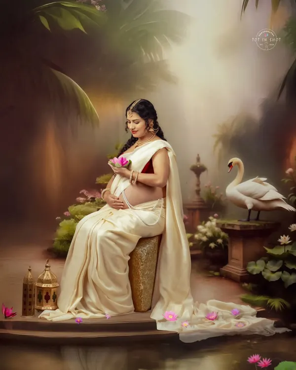 Inspired by the classic tale of Shaakunthalam, this portrait captures the mother-to-be in a serene, painterly setting with a swan and lotus flowers.