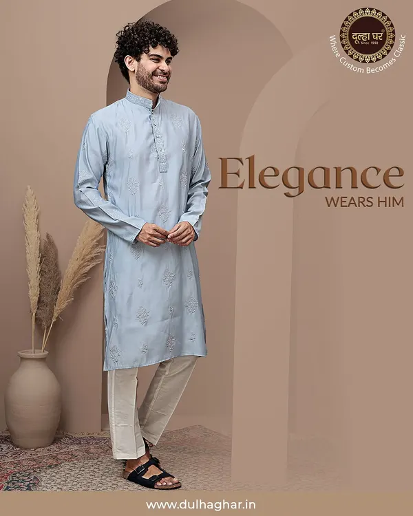 Elegance wears him. This light blue textured kurta, paired with white trousers, is a perfect example of understated style. The fabric has a subtle self-design that adds a touch of sophistication.