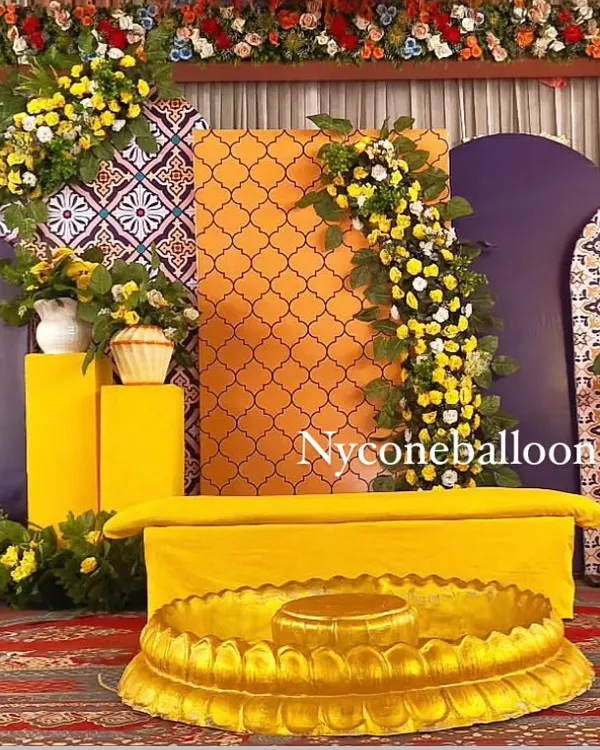 This is a complete Haldi ceremony stage I designed. I combined modern geometric panels in purple and orange with traditional yellow seating and lush floral arrangements to create a vibrant, photo-ready backdrop for the main event.